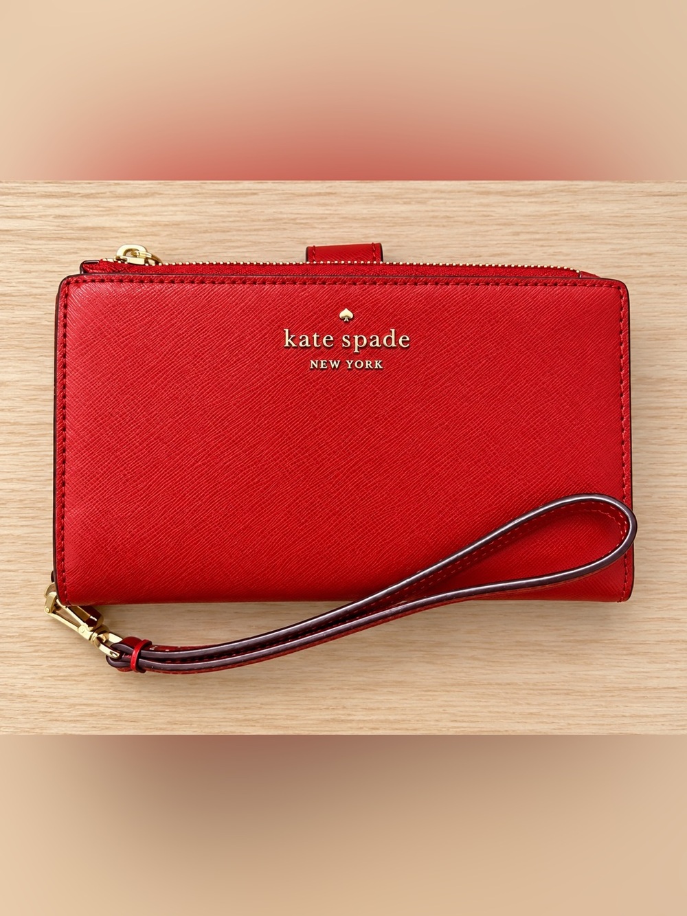 kate spade red saffiano wristlet wallet with gold logo